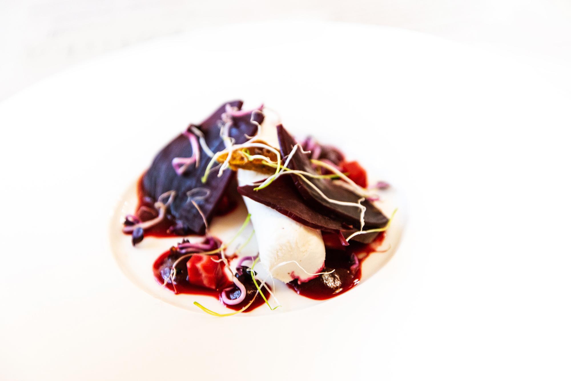 Close-up of modern plated entree with soft lighting