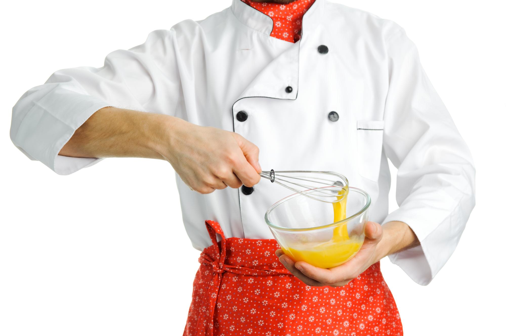 Pastry artist glazing a tart with precision